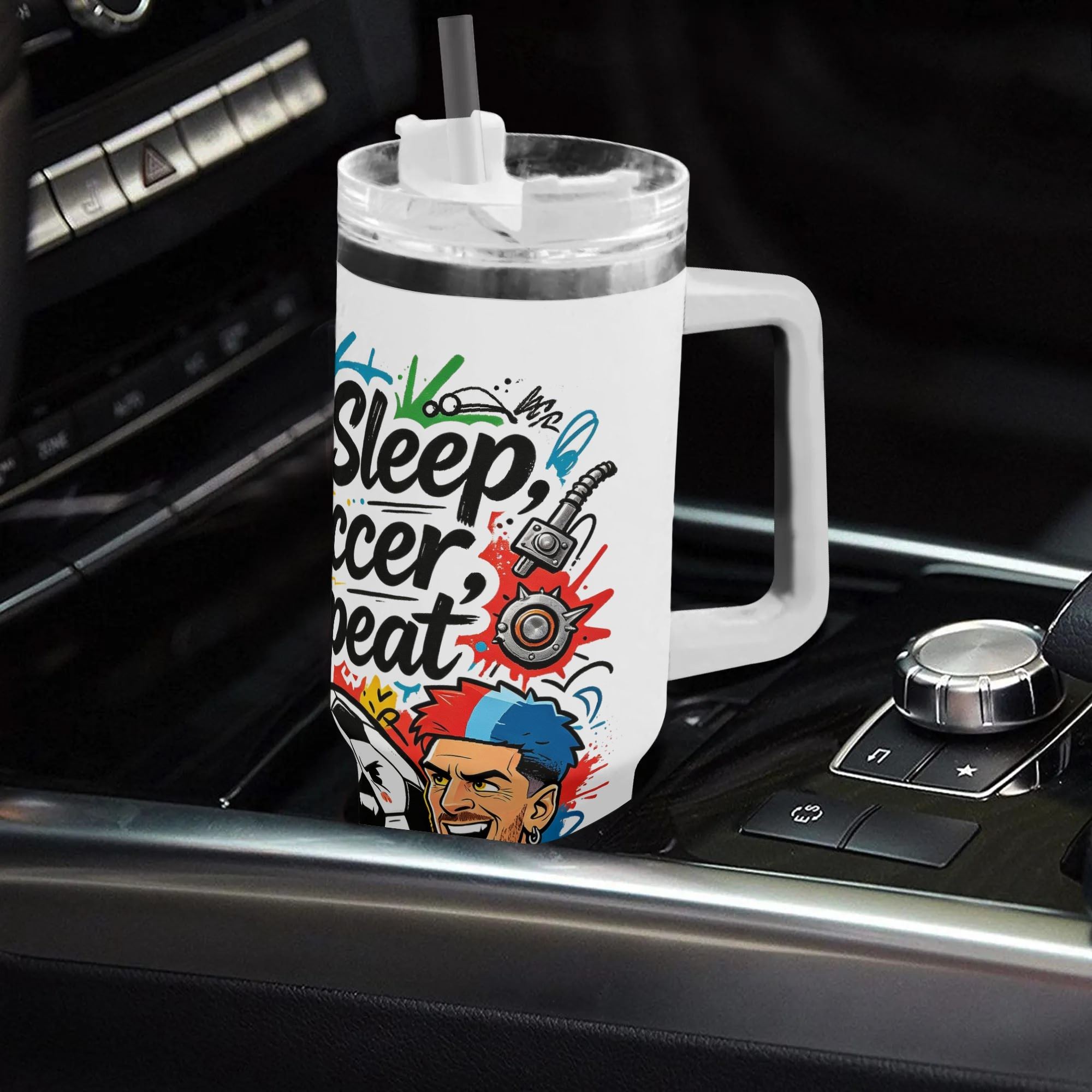40oz edgy punk‑street‑art soccer themed insulated tumbler with handle placed on car center console, striking mohawk‑haired Argentine footballer graphic with colorful splatter‑gear details, leak‑proof straw lid, auto‑safe hot‑cold drink cup