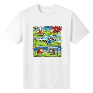 White unisex cotton short‑sleeve t‑shirt, front whimsical 3‑panel comic‑strip print celebrating the 2026 World Cup, with duck, raccoon and hedgehog cartoon soccer players on grass pitch, fun kid‑loving football‑themed fan tee flat lay