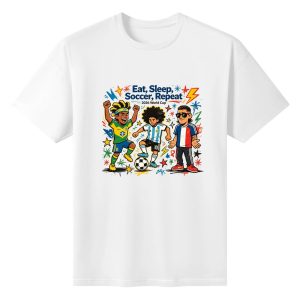 White unisex cotton short‑sleeve t‑shirt, front energetic pop‑graffiti print celebrating the 2026 World Cup, featuring three stylized cartoon soccer players wearing Brazil, Argentina and France national jerseys, bold “Eat, Sleep, Soccer, Repeat!” typography with 2026 World Cup branding, bright multi‑color star‑lightning splatter details, upbeat die‑hard football‑fan‑culture tee flat lay