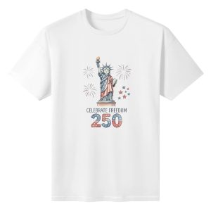 White unisex cotton short‑sleeve t‑shirt, front gentle watercolor patriotic print celebrating America’s 250th anniversary, featuring cute cartoon Statue of Liberty, festive fireworks, star details, freedom‑themed text and flag‑infused “250” typography, warm playful commemorative tee flat lay