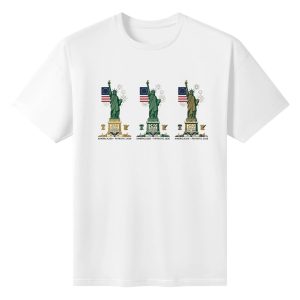 White unisex cotton short‑sleeve t‑shirt, front clean modern patriotic print celebrating America’s 250th anniversary, featuring three aligned Statue of Liberty figures, national flag details, anniversary markings and subtle fireworks, tidy symmetrical commemorative tee flat lay