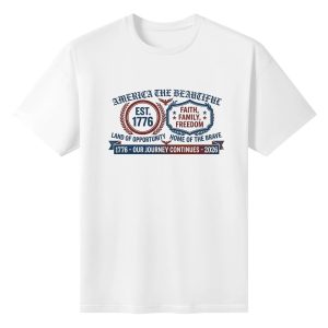 White unisex cotton short‑sleeve t‑shirt, front symmetrical wreath‑badge patriotic print celebrating America’s 250‑year milestone, featuring laurel‑framed founding‑year branding, faith‑family‑freedom mottos, eagle details and journey‑themed banner typography, clean vintage‑badge commemorative tee flat lay