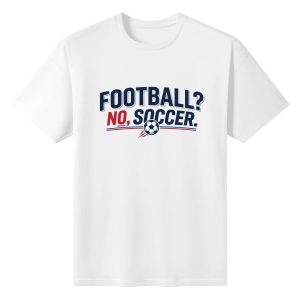 White oversized cotton short‑sleeve t‑shirt, front minimalist bold‑font “Football? No, Soccer.” typography print with soccer ball detail, casual pro‑soccer sports‑themed tee flat lay