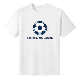 White oversized cotton short‑sleeve t‑shirt, front simple classic soccer‑ball print featuring North America host‑country flags paired with plain “Football? No, Soccer.” text, casual sleek pro‑soccer sports‑themed tee flat lay