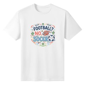 White oversized cotton short‑sleeve t‑shirt, front playful party‑style circular “Football? No, Soccer.” typography print with anti‑football crossed‑out football, kawaii soccer‑ball, colorful bunting, maple leaf, cactus and star details, casual pro‑soccer sports‑themed tee flat lay