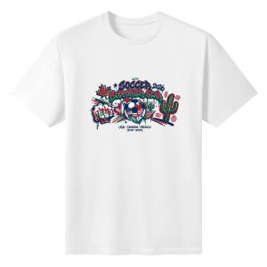 White oversized cotton short‑sleeve t‑shirt, front edgy urban graffiti‑style “Soccer 2026 Supporter Gear” typography print with grunge splatter‑drip effects, flag‑pattern soccer ball, raised cheering fists, maple leaf, cactus and host‑country joint‑hosts text, casual pro‑soccer sports‑themed tee flat lay