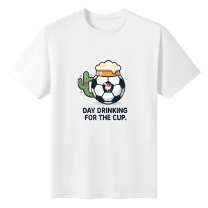 Plain white short‑sleeve crew‑neck t‑shirt featuring playful cartoon‑style soccer‑beer‑mug graphic with North America map detail, desert cactus element and simple bold day‑drinking slogan