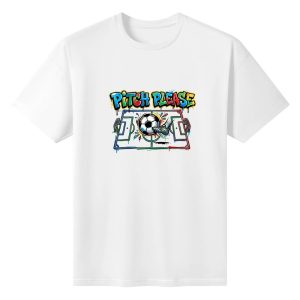 Plain white short‑sleeve crew‑neck t‑shirt featuring colorful multi‑color drip‑graffiti typography, stylized painted soccer pitch graphic with central soccer ball, kicking cleat and splatter‑art accents