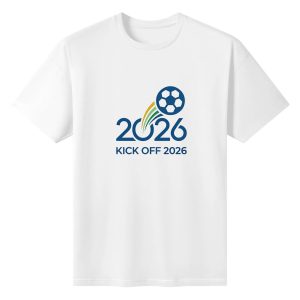 Plain white short‑sleeve crew‑neck t‑shirt featuring clean contemporary 2026 kick‑off soccer emblem, streamlined numeral design, vibrant rainbow‑trail soccer graphic and bold tournament slogan