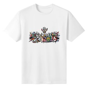Plain white short‑sleeve crew‑neck t‑shirt featuring colorful urban‑graffiti kick‑off slogan, integrated soccer‑ball icons, US‑Canada‑Mexico decorative elements and dynamic street‑art accents for the 2026 World Cup