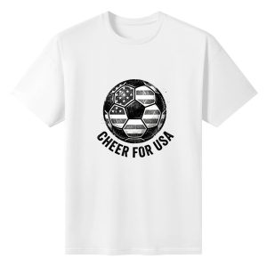 Plain white short‑sleeve crew‑neck t‑shirt featuring retro distressed monochrome soccer‑ball graphic printed with American flag pattern and arched patriotic cheering slogan