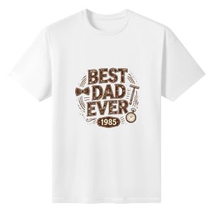 Plain white short‑sleeve crew‑neck t‑shirt featuring sepia‑toned distressed “BEST DAD EVER” slogan, classic dad accessories (bow tie, razor, pocket watch) and personalized year “1985” in a vintage badge