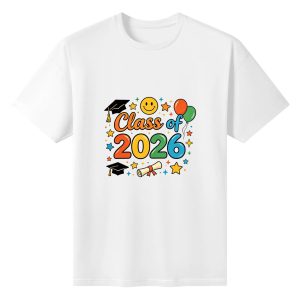 White short-sleeve crewneck T-shirt with colorful “Class of 2026” graphic, featuring graduation caps, a diploma, balloons, stars, and a smiley face.
