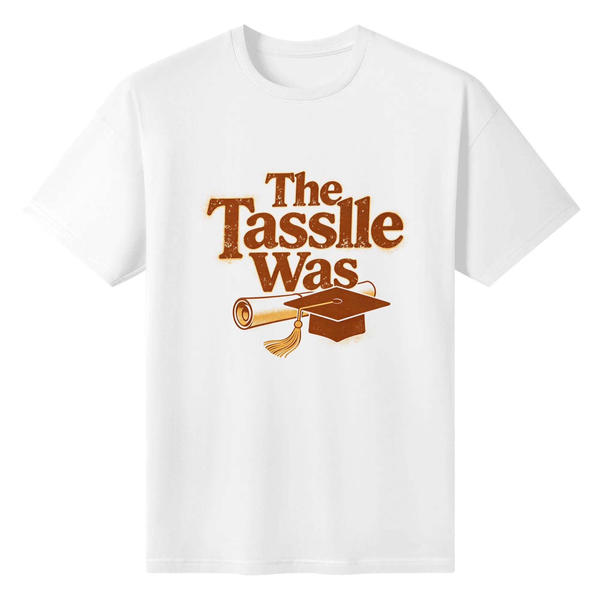 White crewneck T-shirt with a retro-style “The Tassle Was” graphic, featuring distressed brown lettering, a graduation cap, and diploma.