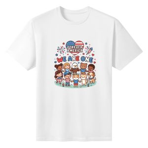 White t-shirt flat lay with the full "Forever America We Are One" print, showing the colorful patriotic graphic with kids, animals, and fireworks.