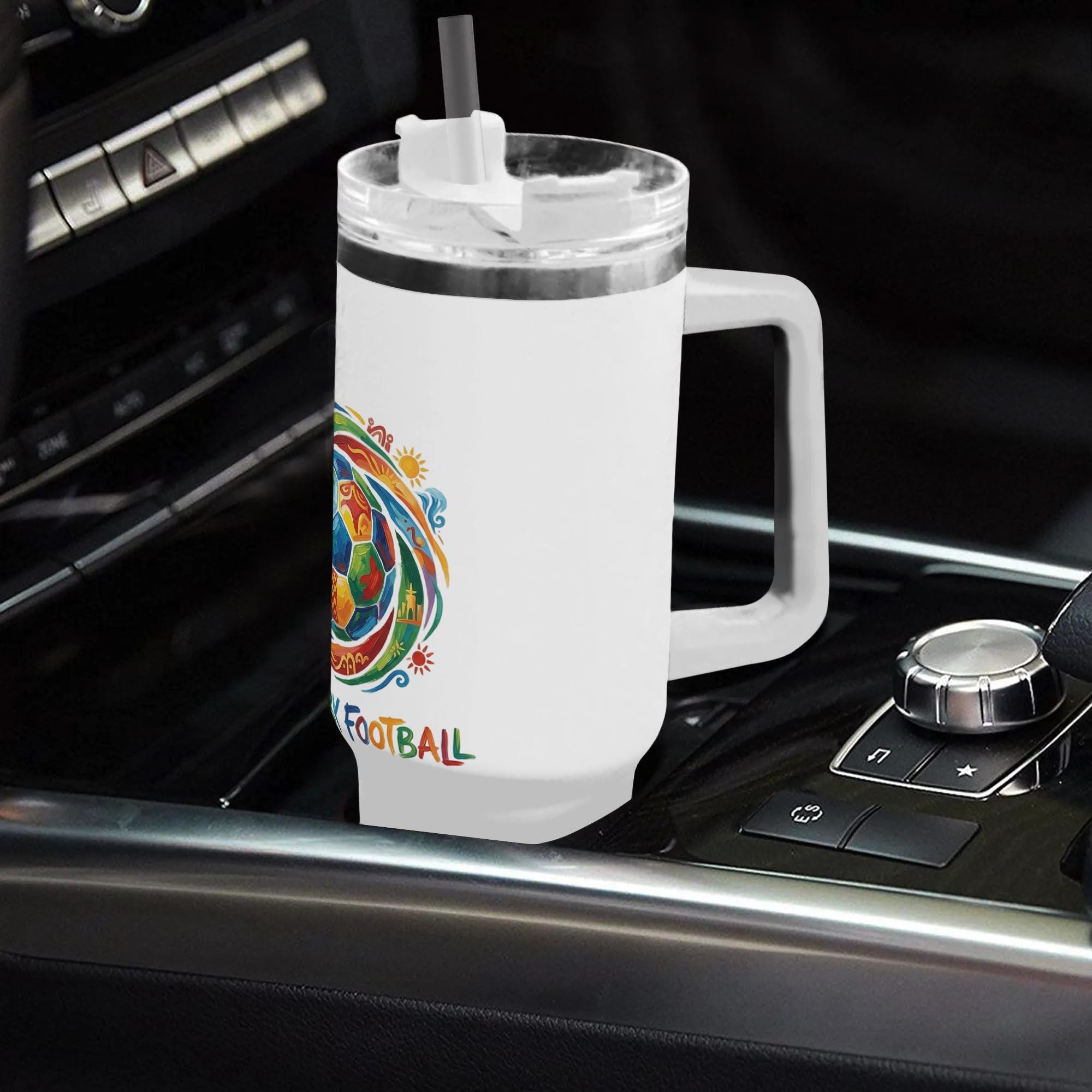 "United by Football" tumbler placed in a car cup holder, showing its fit for on-the-go use.
