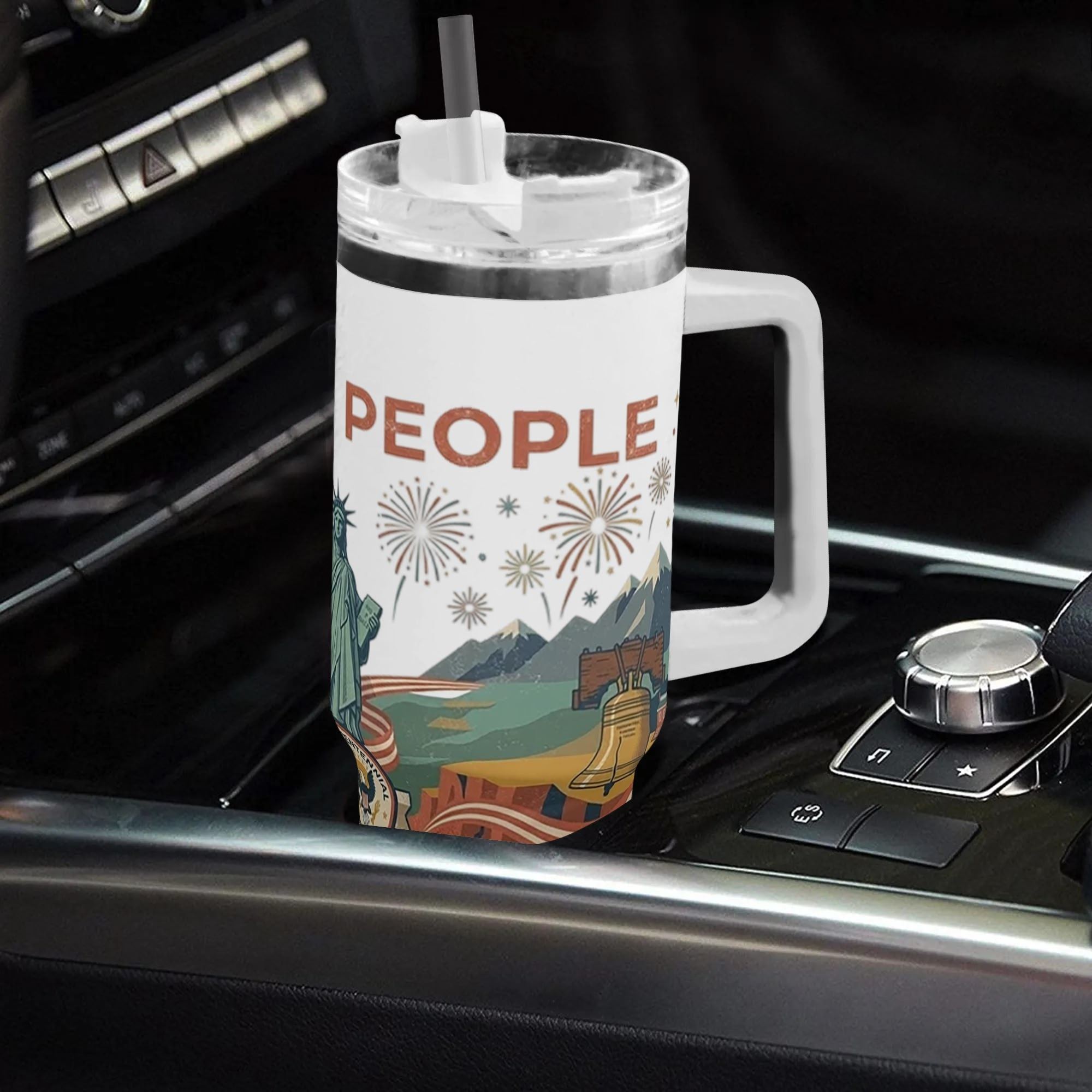Tumbler placed inside vehicle center console to show in-car daily commute use with straw assembled.