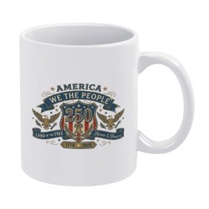 White 11oz ceramic mug with vintage double eagle shield USA 250 graphic, printed with We The People and Land of the Free slogans.