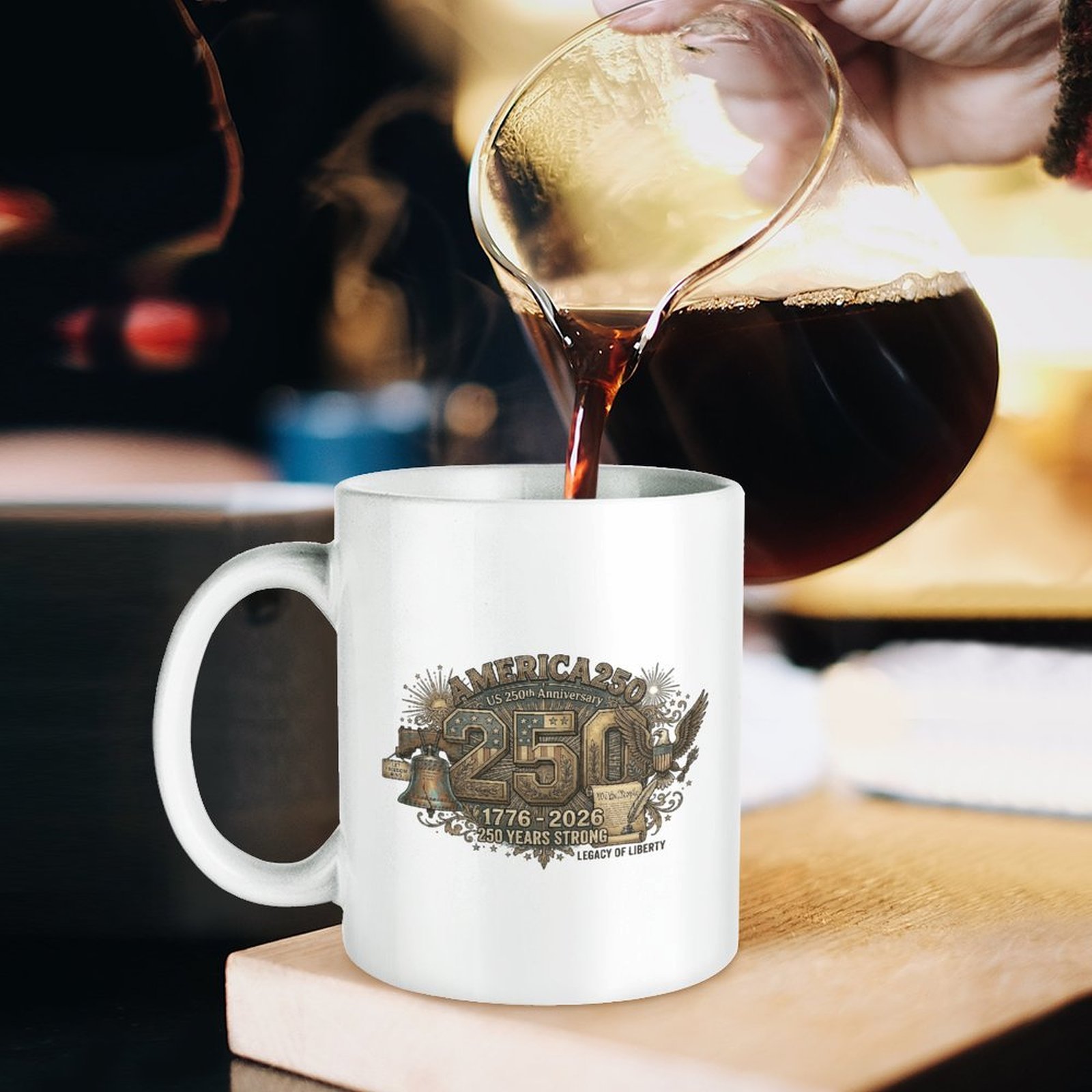 Lifestyle shot: coffee being poured into the patriotic printed mug on wooden countertop.