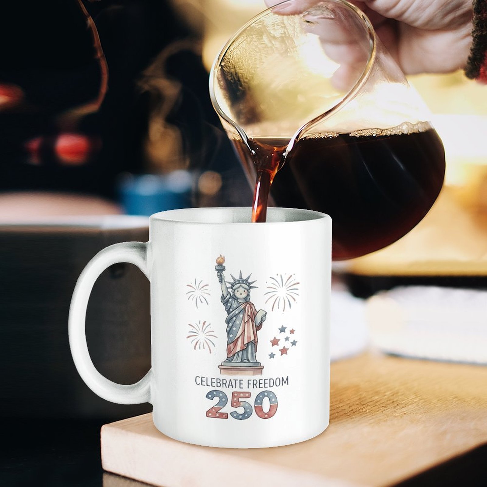 "Celebrate Freedom 250" mug being poured with coffee, styled as a cozy patriotic drinkware piece for the 250th anniversary.