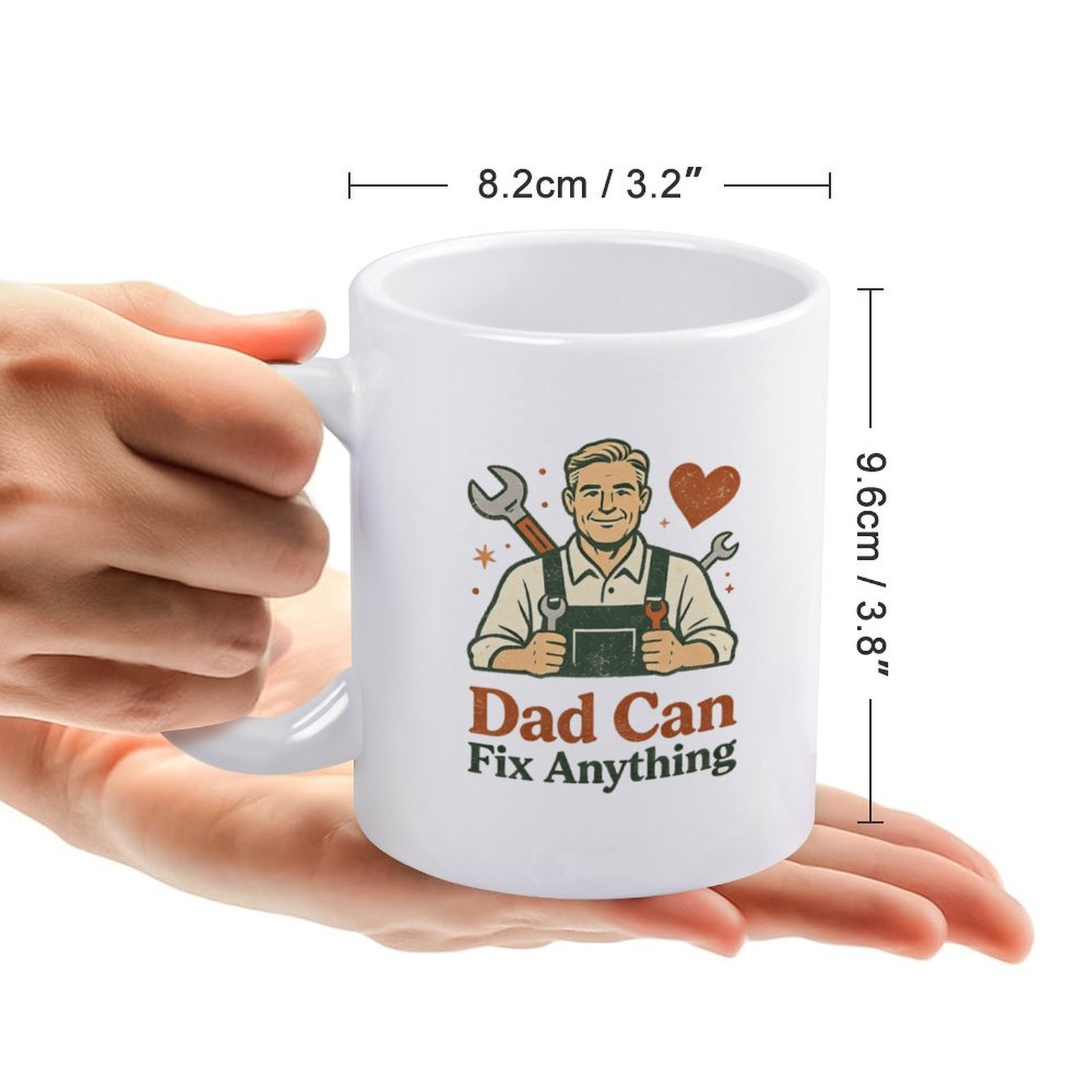 Size chart for the "Dad Can Fix Anything" mug, showing dimensions: 8.2cm/3.2" wide, 9.6cm/3.8" tall, with a hand holding the mug for scale.