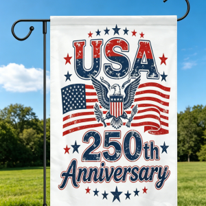 The USA 250th Anniversary garden flag displayed on a flagpole against a clear blue sky.