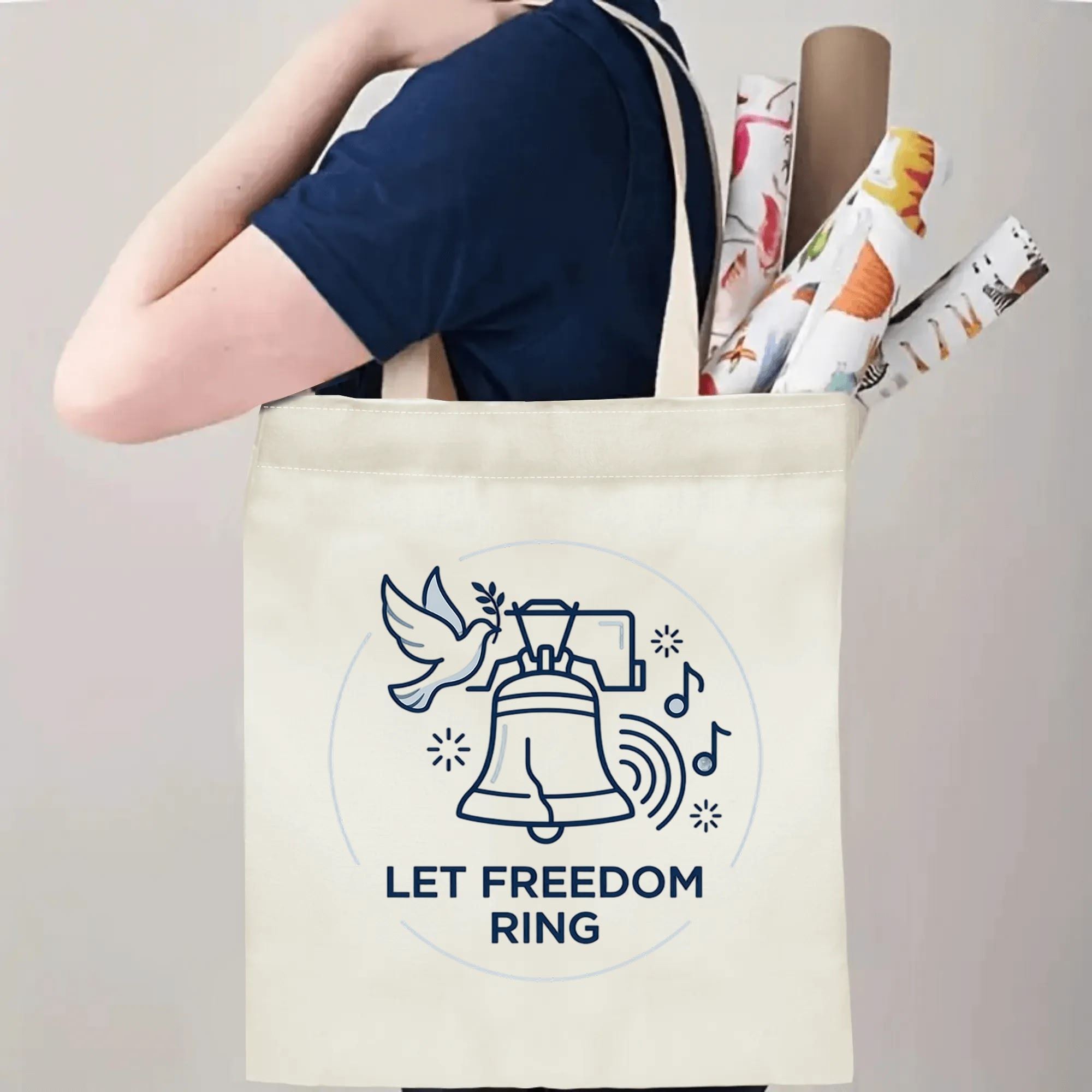 Model carrying navy outline peace dove Liberty Ring slogan canvas tote bag for daily shopping and casual outdoor carry