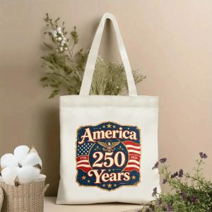 Patriotic tote bag styled with dried flowers, showing the front print clearly