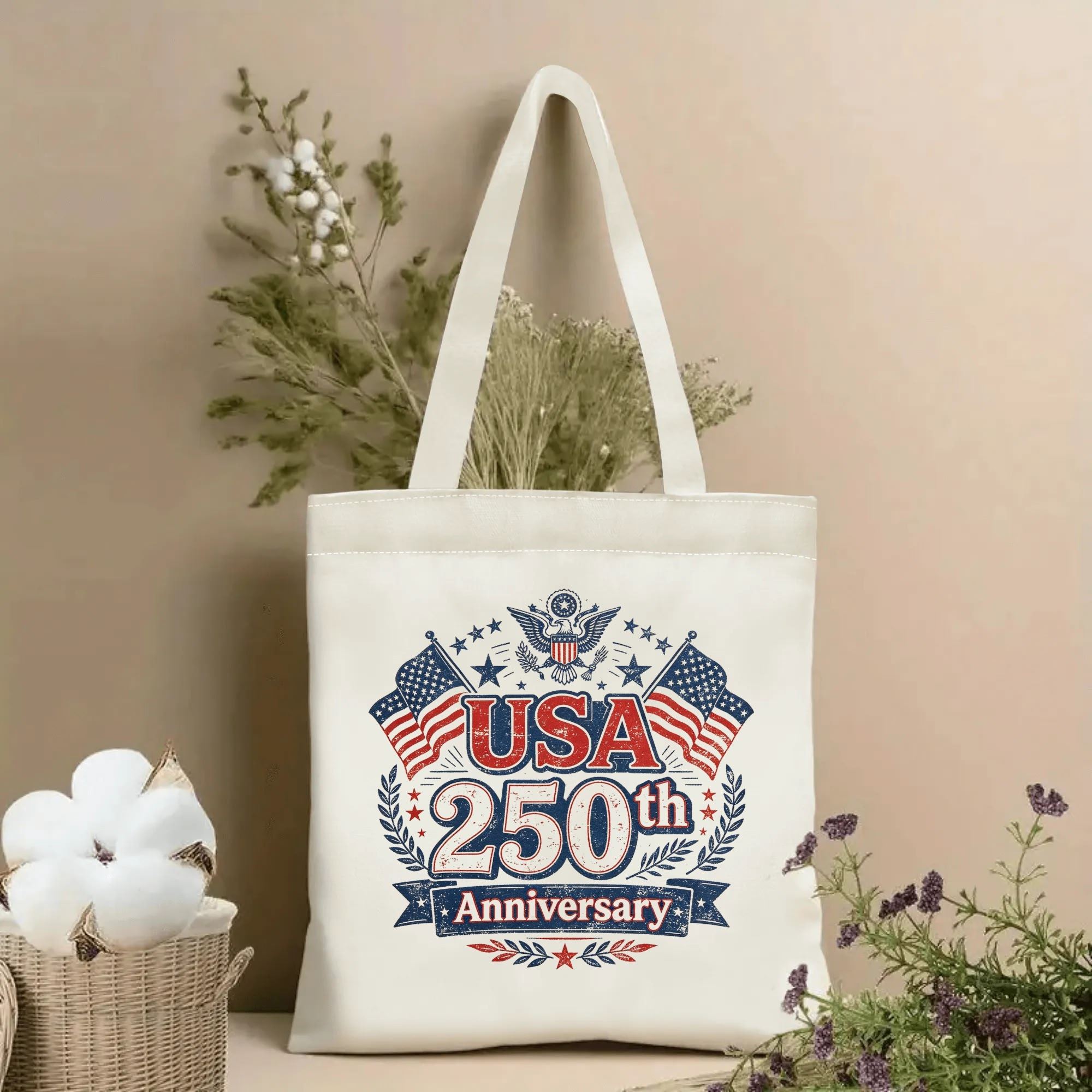 Lifestyle shot of the “USA 250th Anniversary” canvas tote bag, styled with dried flowers in a home setting