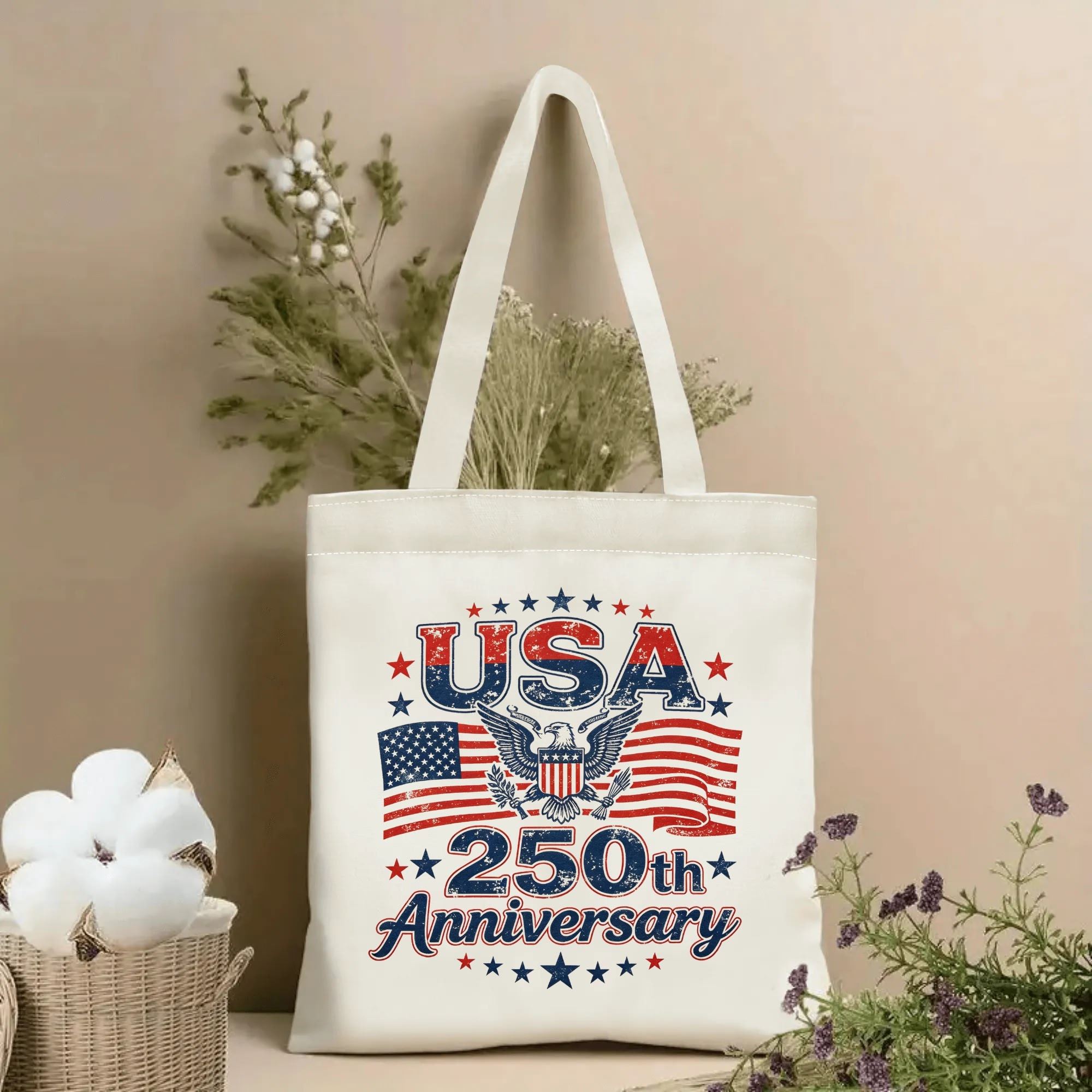 Lifestyle shot of the “USA 250th Anniversary” canvas tote bag, styled with dried flowers in a home setting