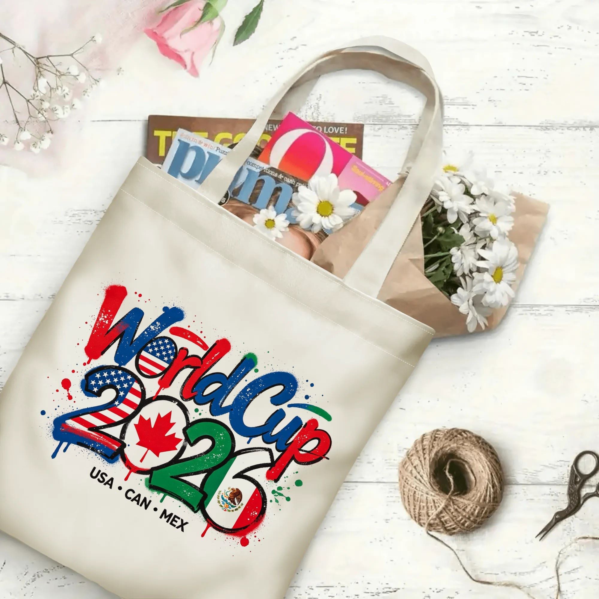 The tote bag in use, filled with books and flowers, showing the “World Cup 2026” print in a casual, everyday setting.