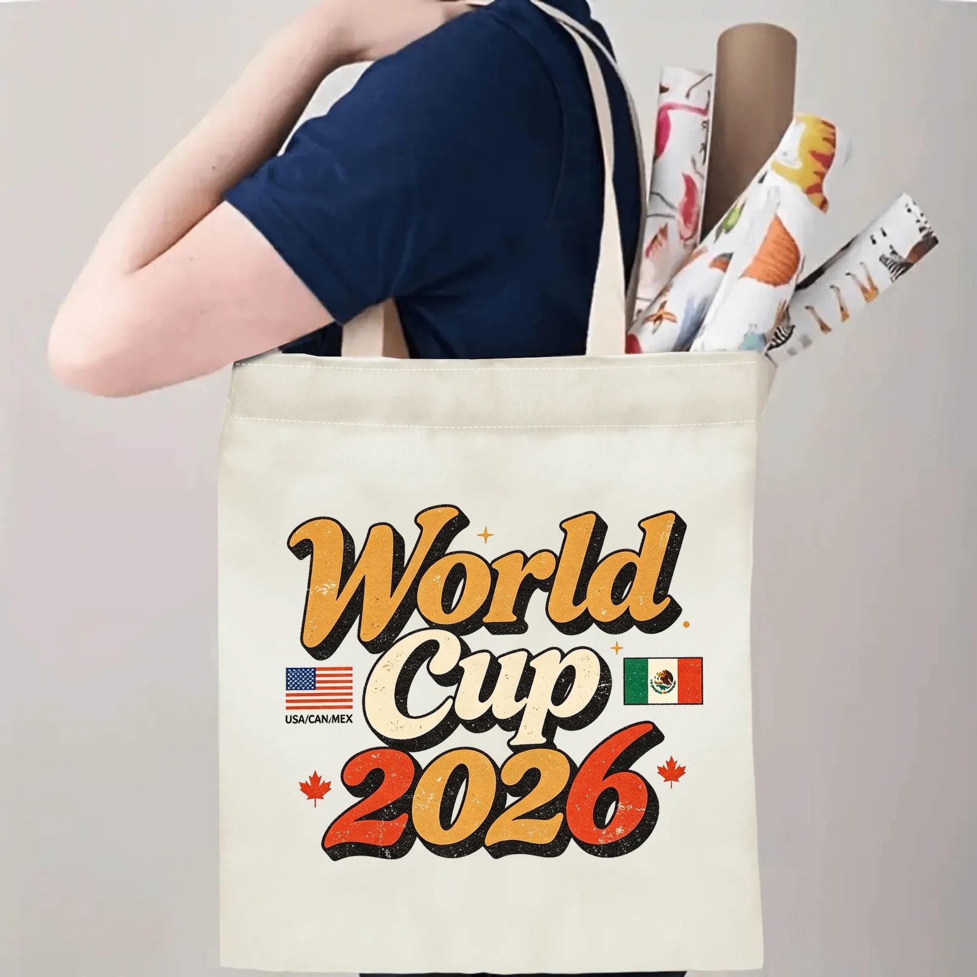 Person carrying the “World Cup 2026” retro-style tote bag over the shoulder, demonstrating its size and practical use.