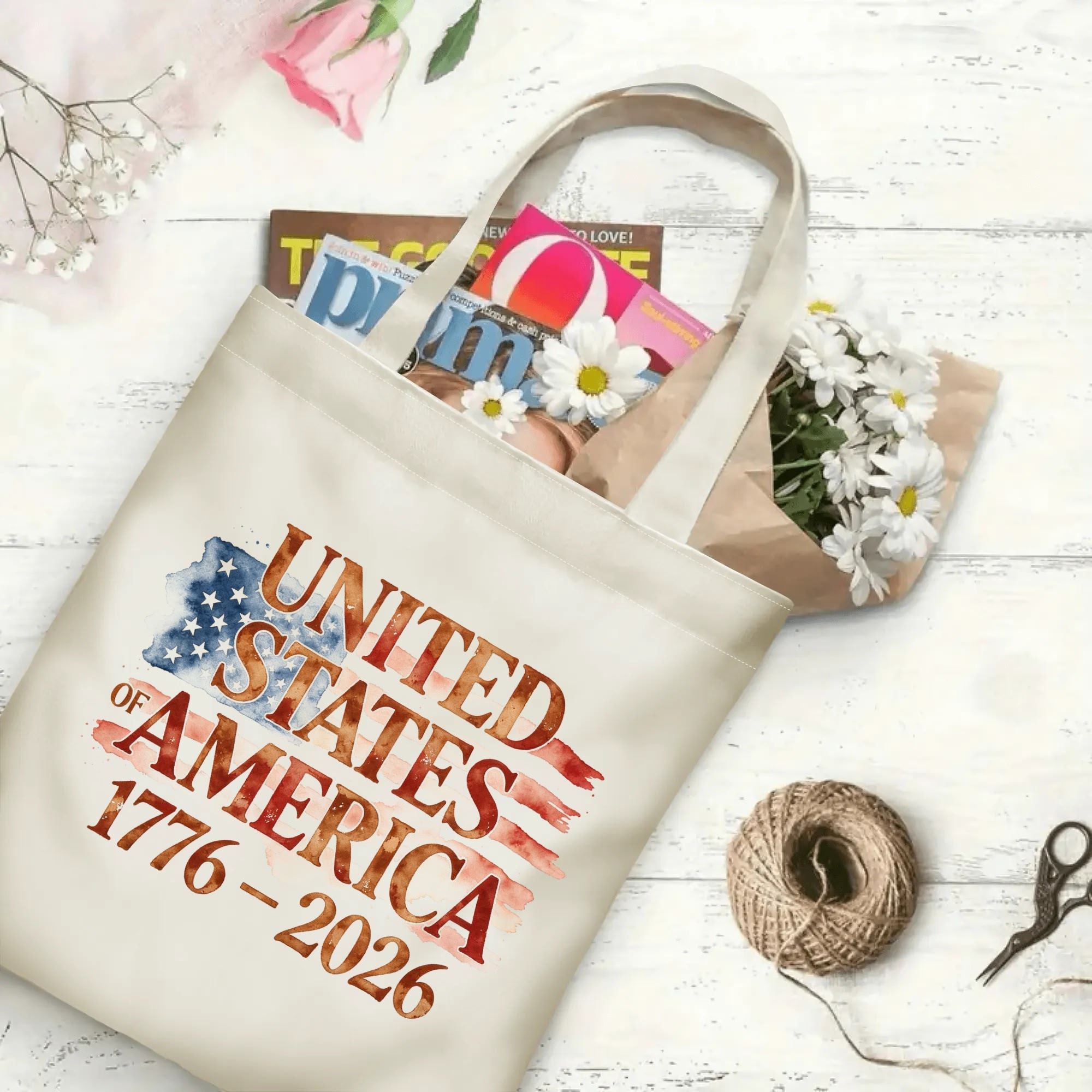 The same tote bag shown open, filled with books, flowers, and craft supplies, to display its spacious capacity.
