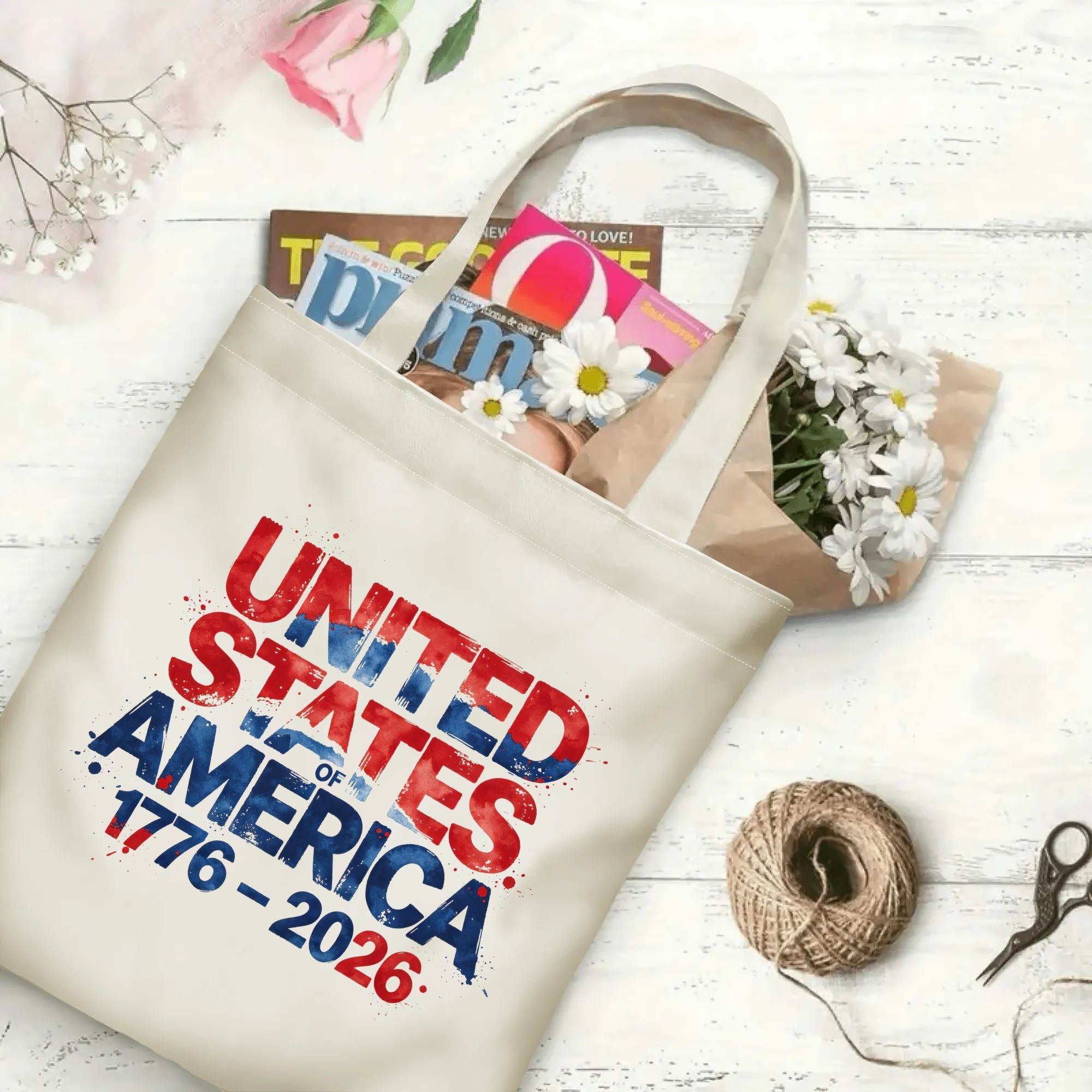 The same tote bag shown open, filled with books, flowers, and craft supplies, to display its spacious capacity.