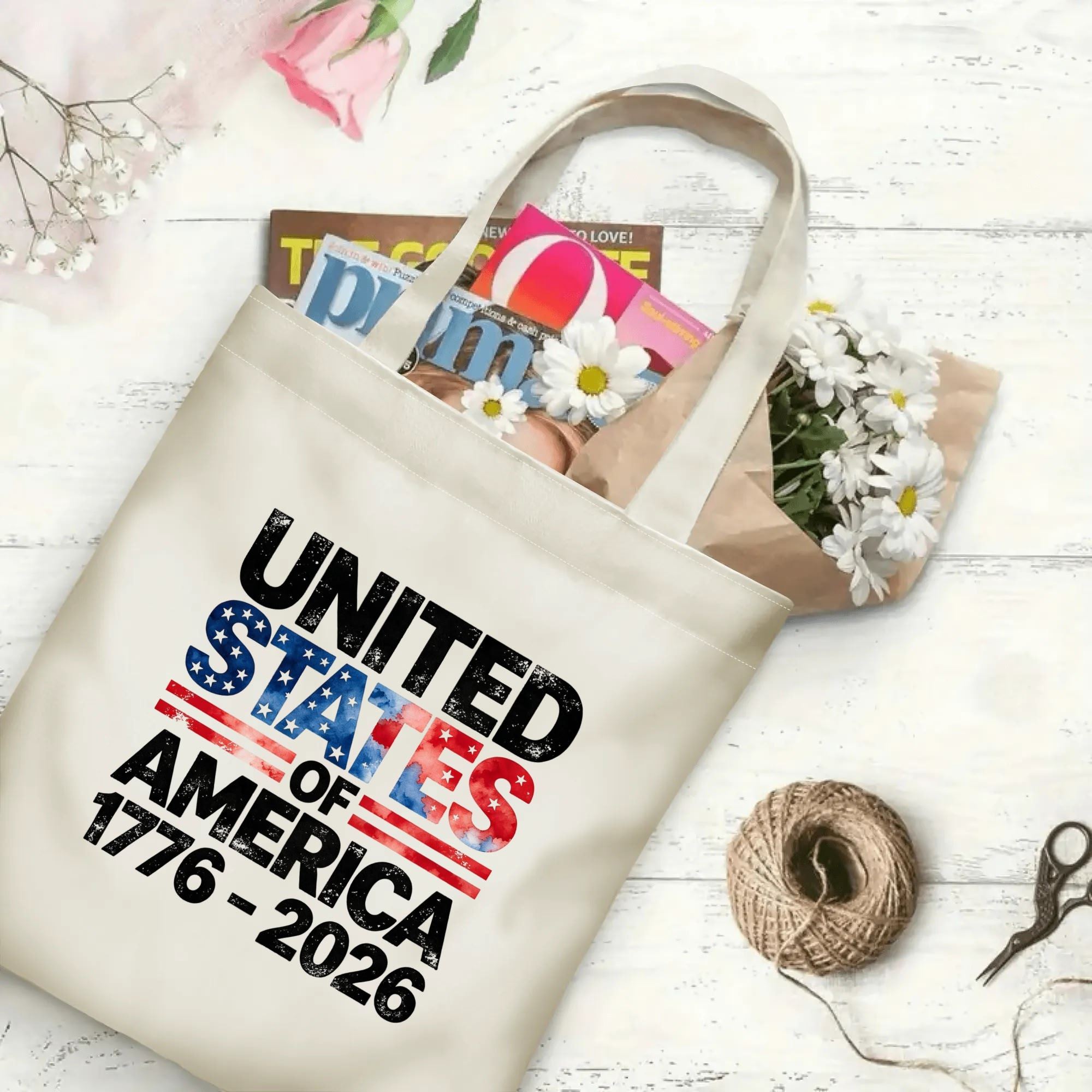 The same tote bag shown open, filled with books, flowers, and craft supplies, to display its spacious capacity.