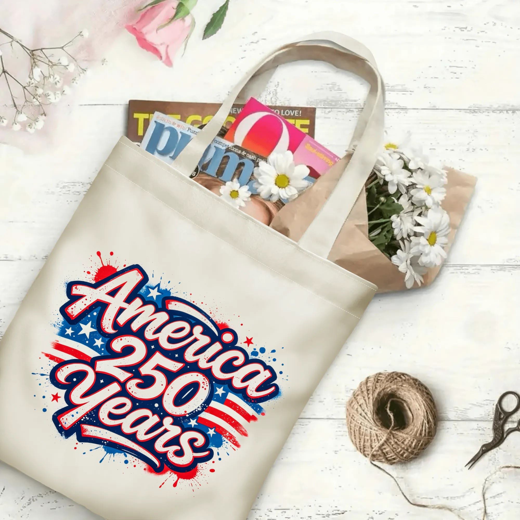 The same tote bag shown open, filled with books, magazines, and flowers, displaying its spacious capacity and print clearly.