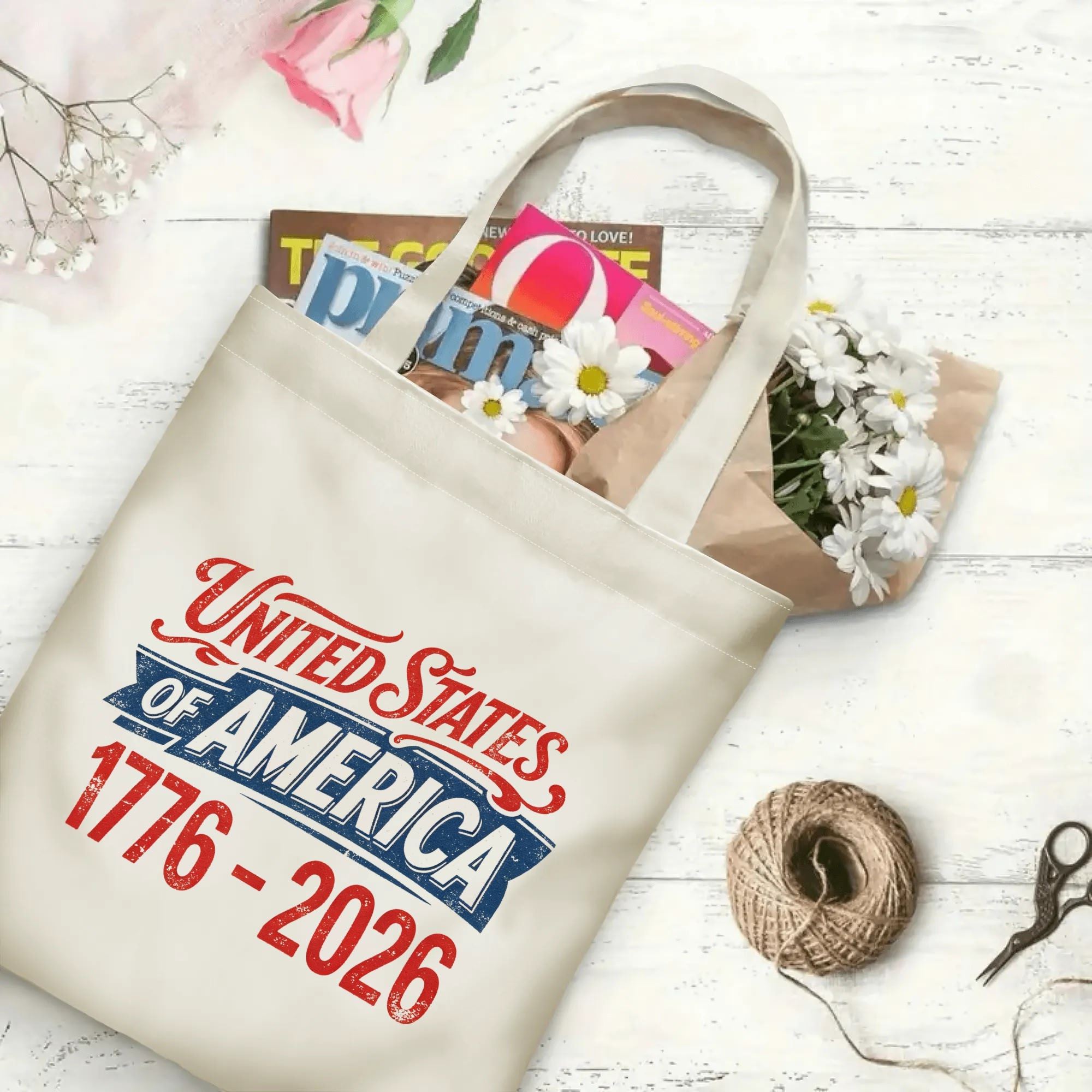 The same tote bag shown open, filled with books, magazines, and flowers, displaying its spacious capacity and print clearly.