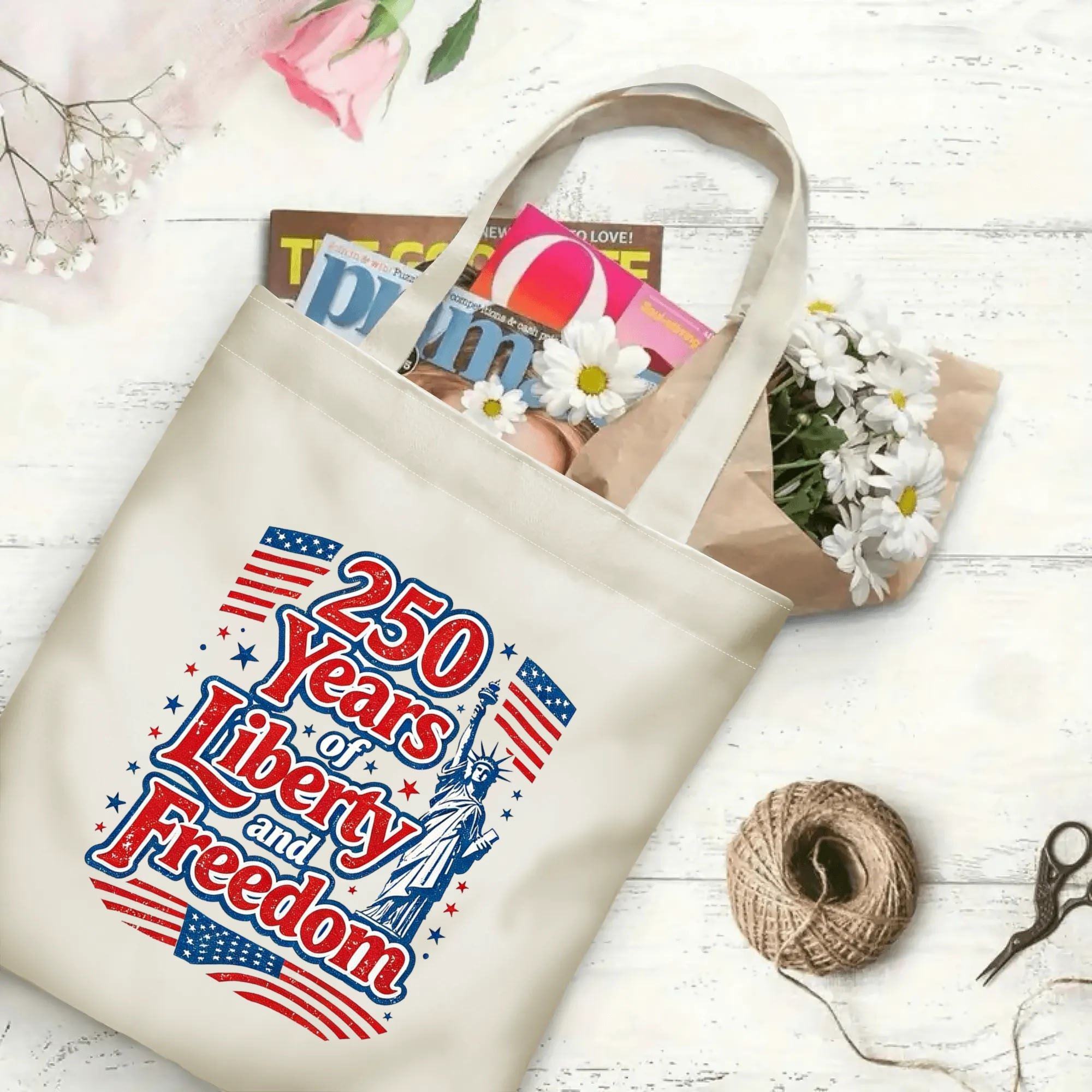 The same tote bag shown open, filled with books, magazines, and flowers, displaying its spacious capacity and print clearly.