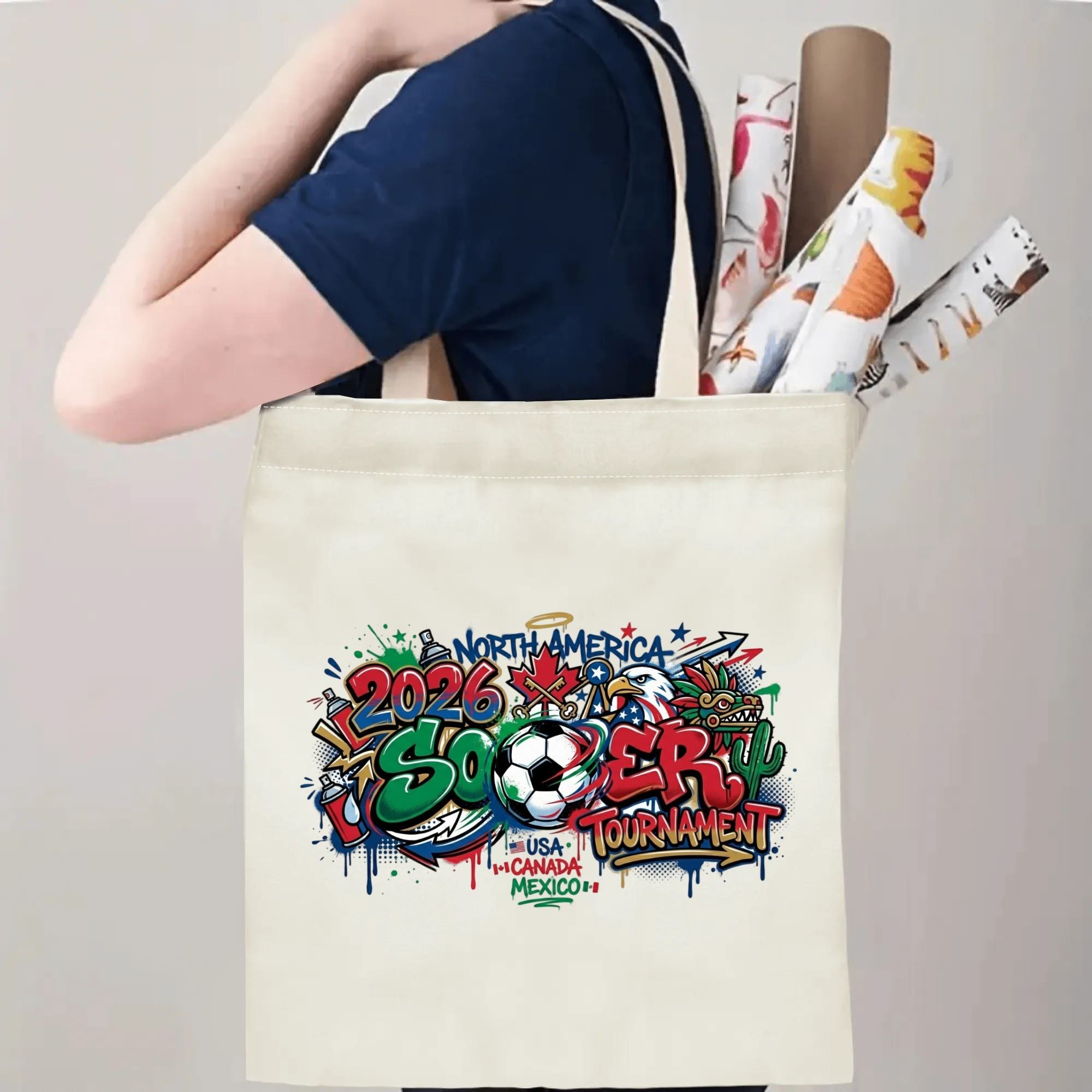 Male model carrying 2026 World Cup graffiti cotton tote bag over shoulder, large capacity soccer supporter canvas handbag for match day outings