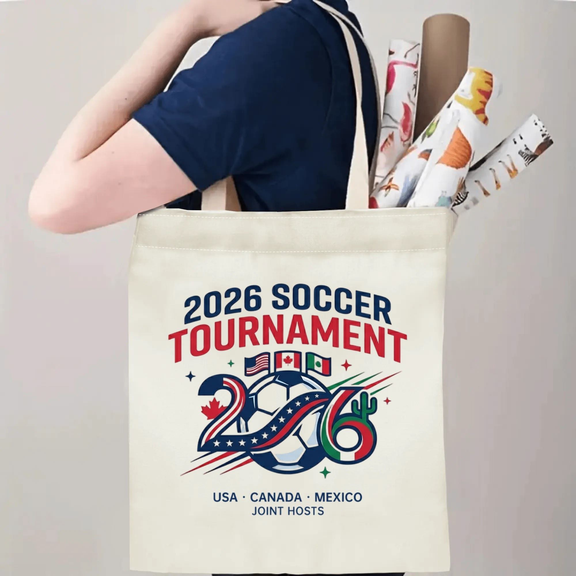 Person slinging simple 2026 soccer tournament canvas tote bag over shoulder, large capacity athletic football fan carry bag for stadium trips
