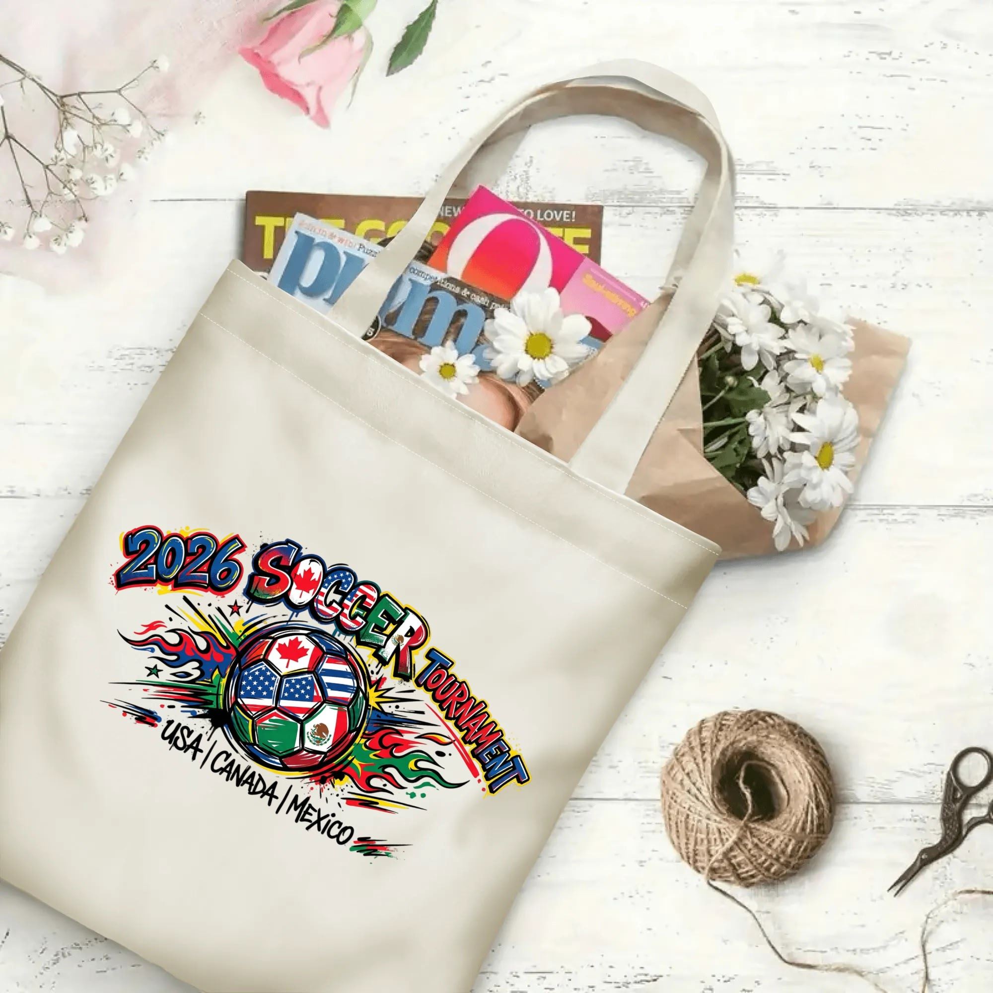 2026 football tournament splash flame graffiti North America soccer polyester canvas tote bag flat laid with magazines, daisies and twine, reusable street style fan daily shopping bag