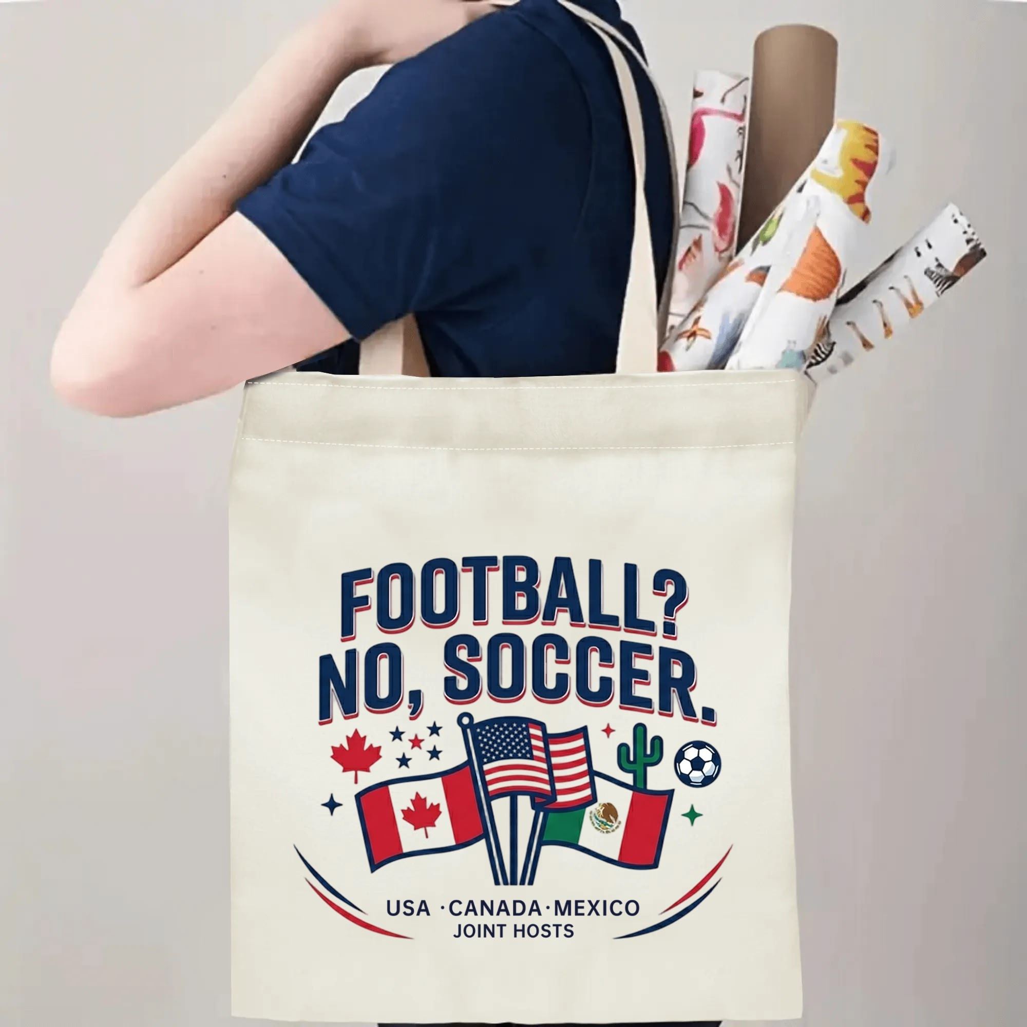 Person slinging humorous three-host flag soccer tote bag over shoulder, large capacity conversational football fan carry bag for stadium trips