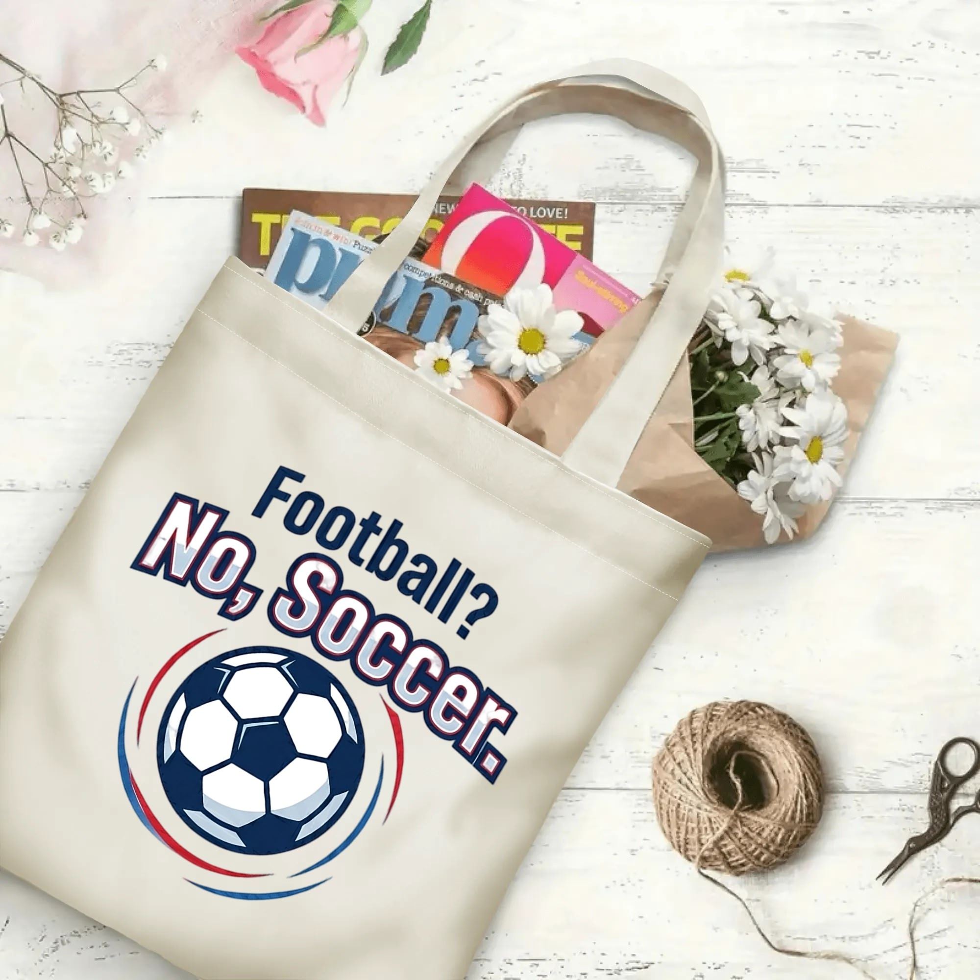 Retro varsity soccer quote circle graphic canvas tote bag laid flat with magazines and daisies, reusable casual sport fan daily shopping bag