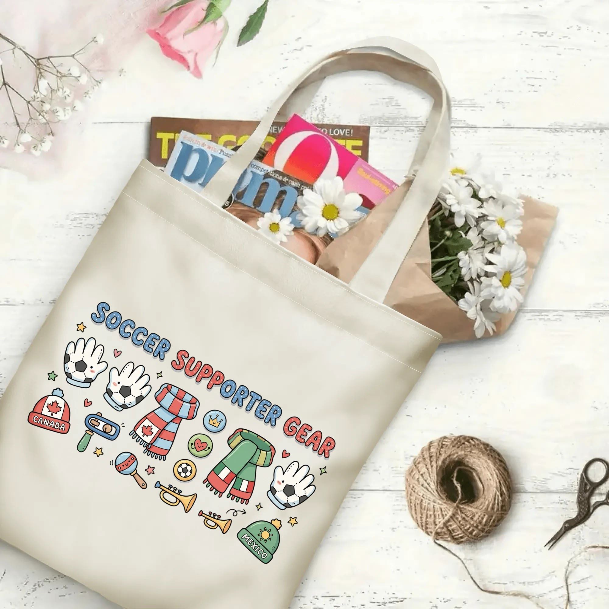2026 football tournament cartoon hand drawn fan gear polyester canvas tote bag flat laid with magazines, daisies and twine, reusable sweet fan daily shopping bag