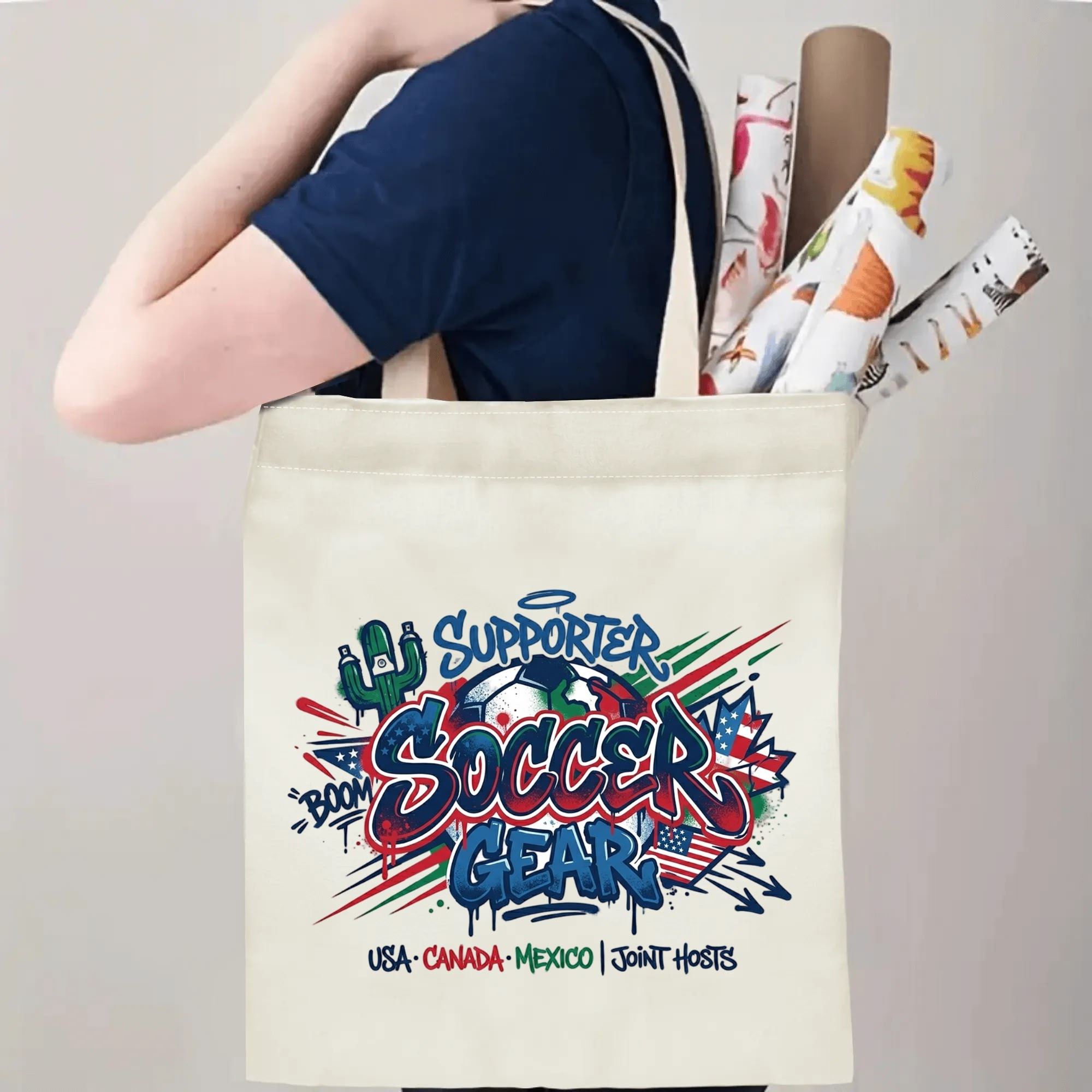 Person slinging bold drip graffiti three-nation soccer tote bag over shoulder, large capacity standout football supporter carry bag for stadium trips