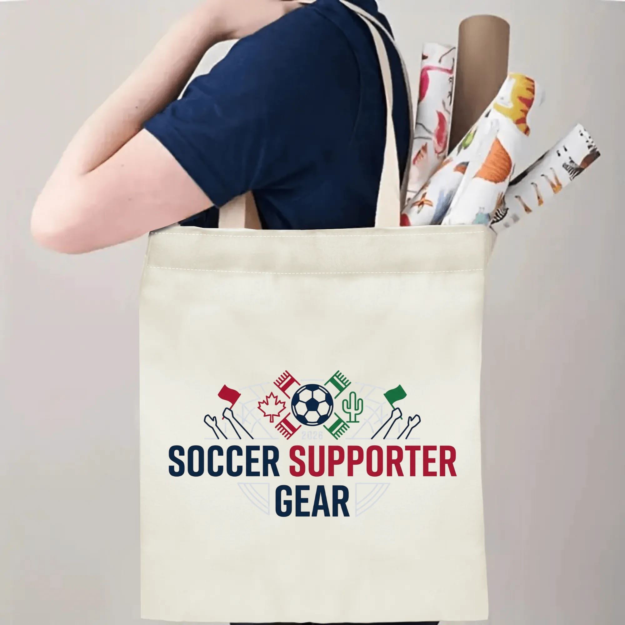 Person slinging 2026 USA Canada Mexico soccer supporter tote bag over shoulder, large capacity minimalist football fan carry bag for stadium outings