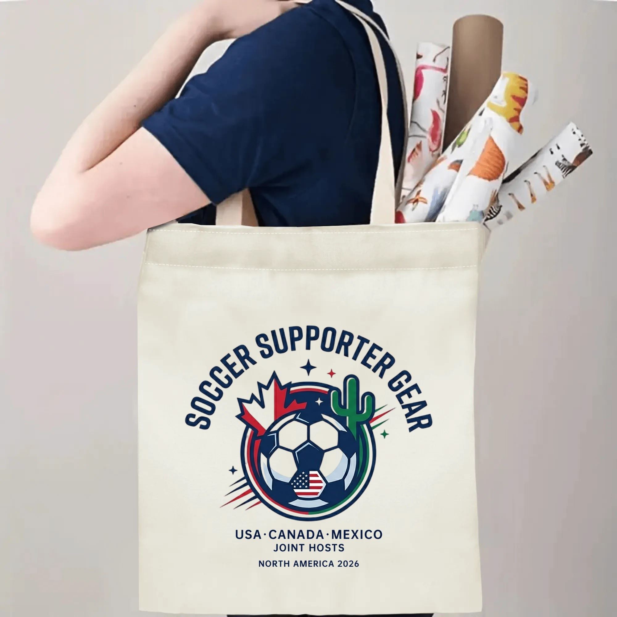 Person slinging classic circular North America 2026 soccer tote bag over shoulder, large capacity quiet patriotic football fan carry bag for stadium trips