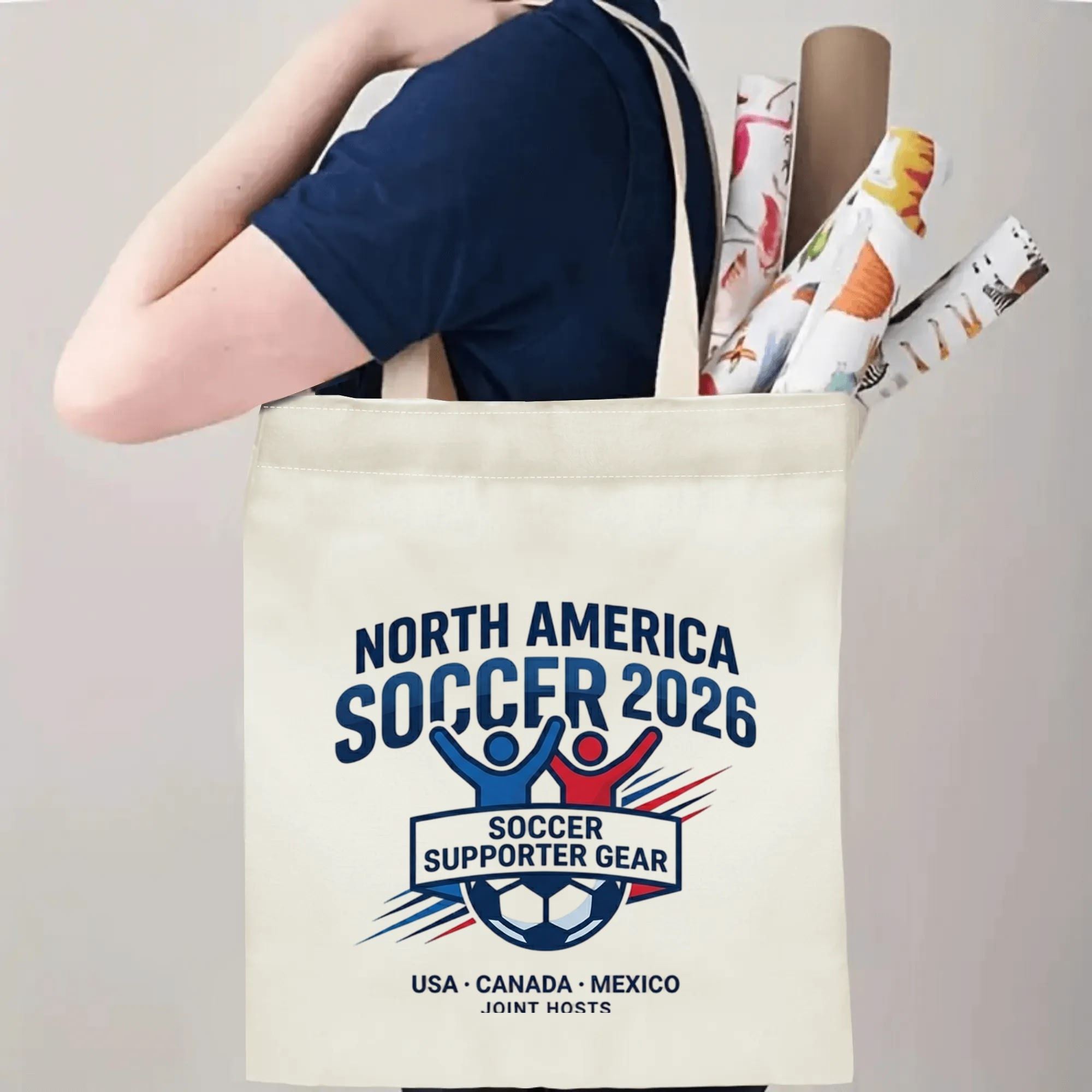 Person slinging 2026 World Cup USA Canada Mexico joint host emblem polyester canvas tote bag over shoulder, large capacity athletic football supporter carry bag for stadium outings
