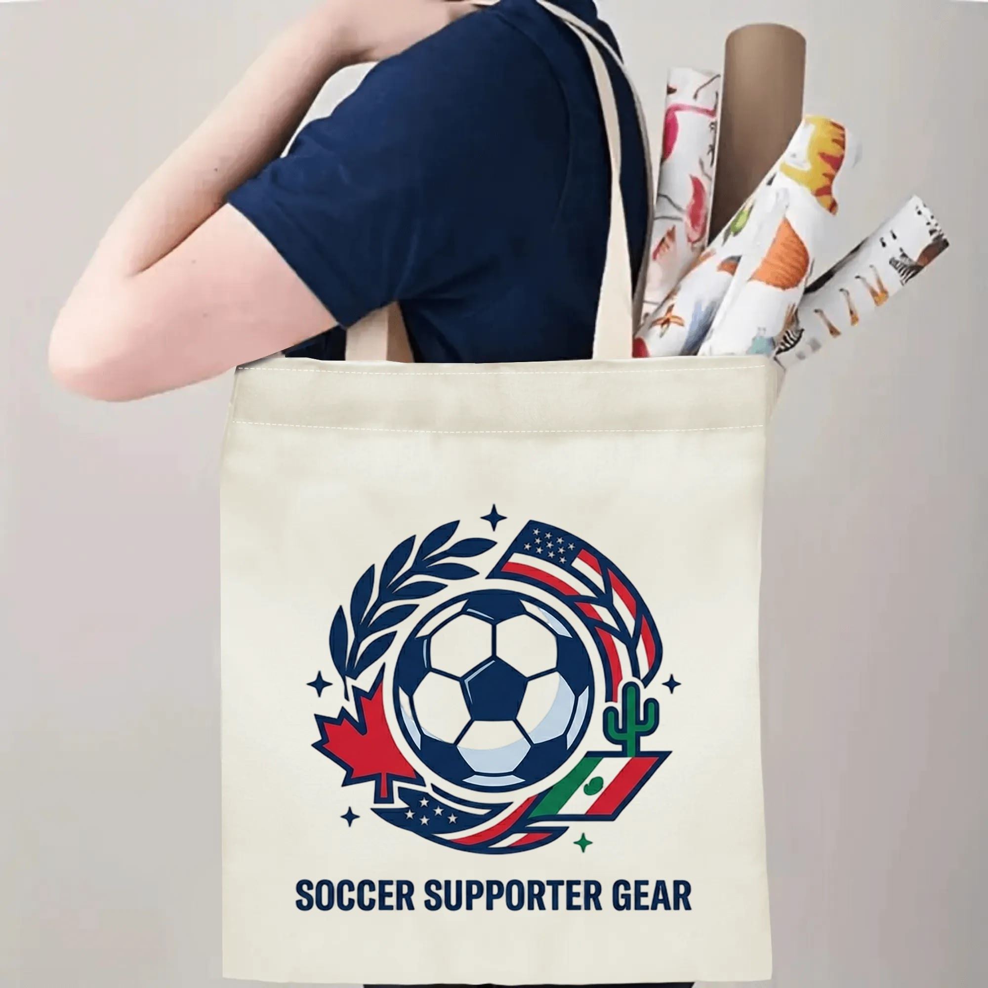 Person slinging 2026 World Cup USA Canada Mexico laurel wreath soccer emblem polyester canvas tote bag over shoulder, large capacity minimalist football supporter carry bag for stadium outings