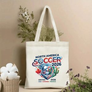 2026 World Cup modern gradient North America soccer shield crest print canvas tote bag, three-host maple cactus eagle patriotic fan eco shoulder bag indoor wall styling photo